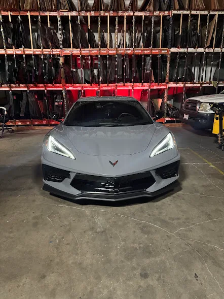 Corvette back glass being replaced by a Majesty Auto Glass technician
