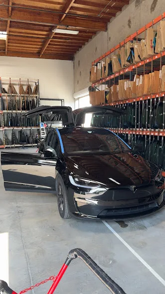 Tesla Model X receiving rear glass service at the Majesty Auto Glass shop in Chula Vista